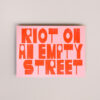 Los patos riso riot on an empty street